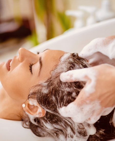 Portrait of women which wash hair in a beauty salon.Hairdresser washing hair.
